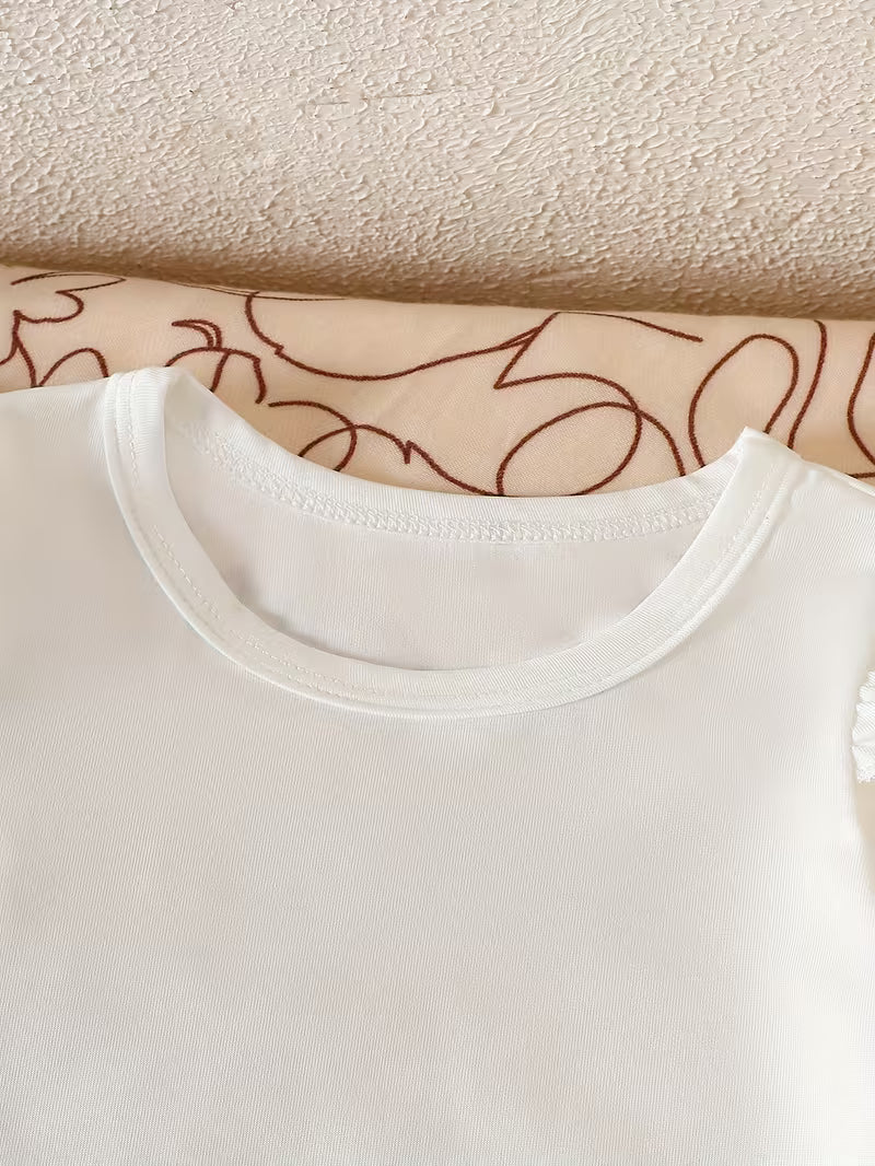 Pure White Long-sleeved Romper with Flutter Sleeves Paired with a Denim Floral Print