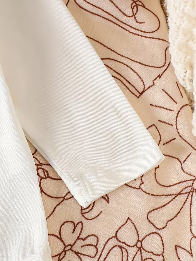 Pure White Long-sleeved Romper with Flutter Sleeves Paired with a Denim Floral Print